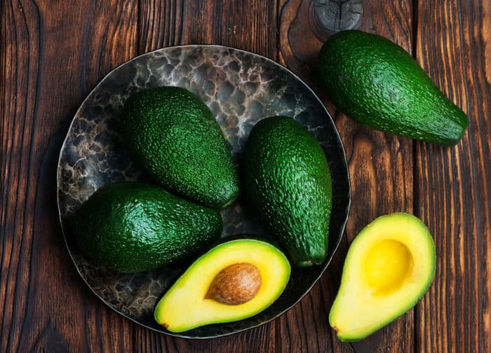 Image of green avocados on a table