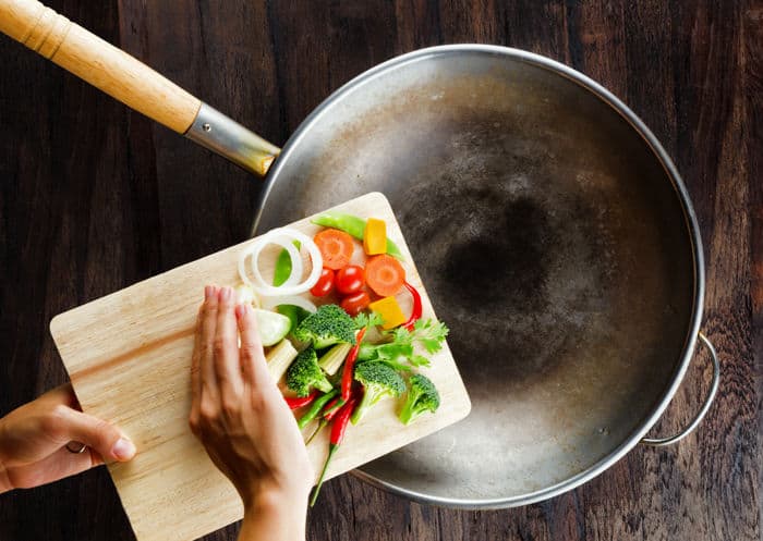 Photo of carbon steel wok with pre-cut veggies