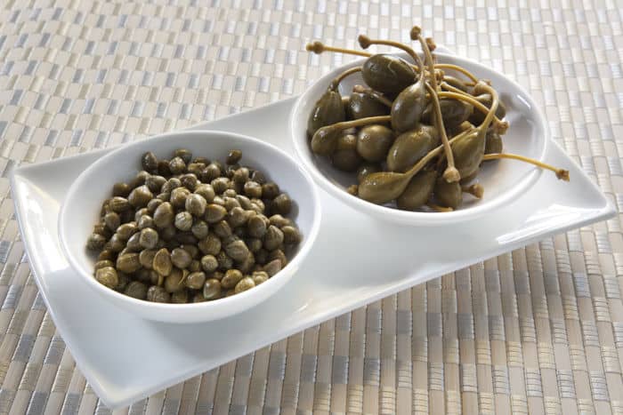 Image of capers and caper berries in bowls