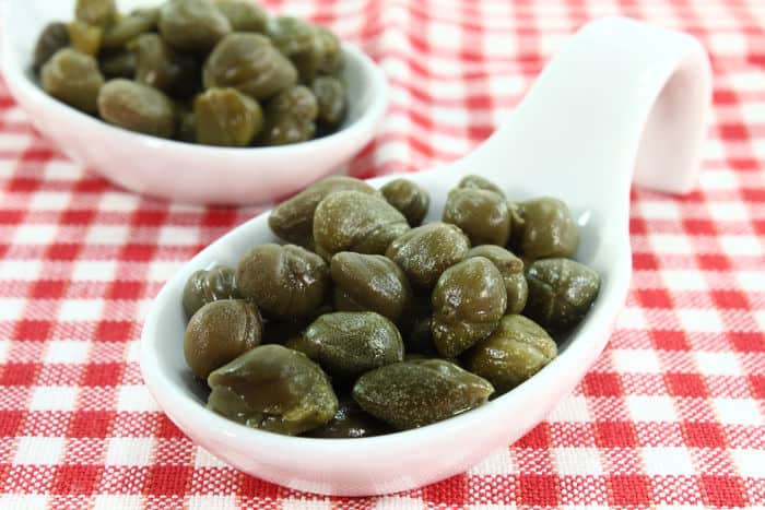 Image of capers on a chekered table