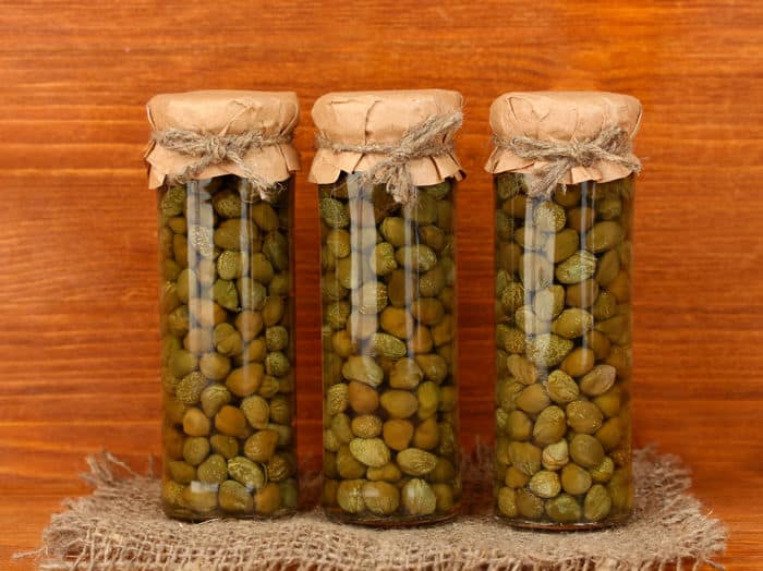 Image of capers in preserving jars