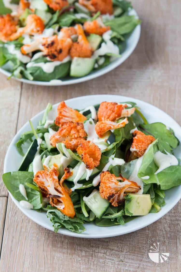 Mixed Green Salad With Buffalo Roasted Cauliflower, Avocado, and Cucumber Ranch Dressing