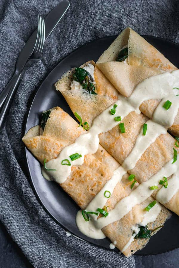 Savory Crepes with Almond Cheese, Sautéed Spinach and Vegan Hollandaise