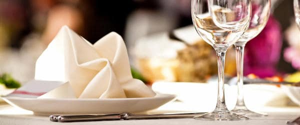 Plate and wine glasses on a restaurant table