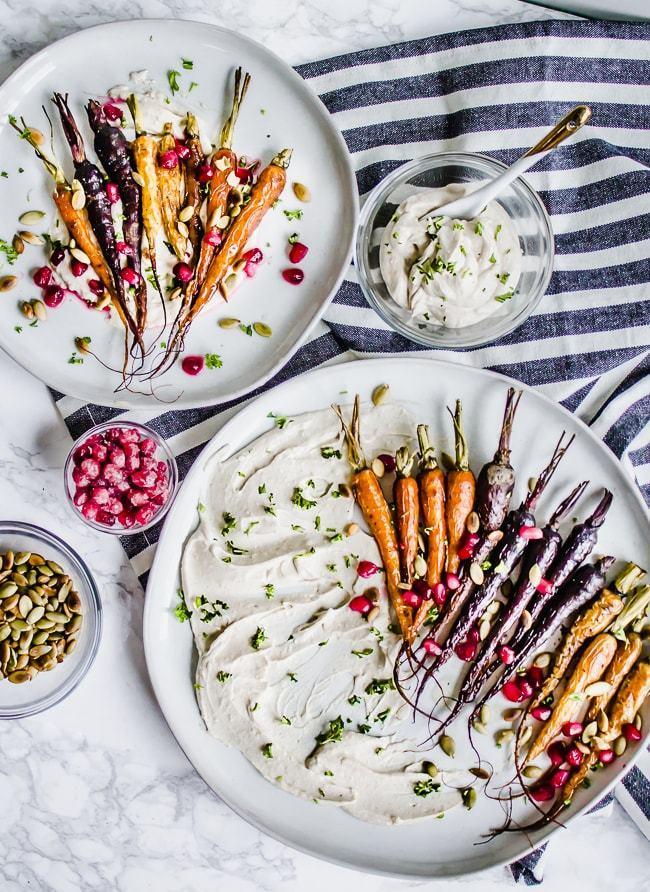 Oven Roasted Tri-Colored Carrots with Toasted Pumpkin Seeds, Pomegranate, and Garlic Tahini Yogurt